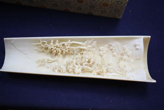 A pair of Chinese ivory wrist rests, early 20th century, 20.5cm, silk brocade covered stands